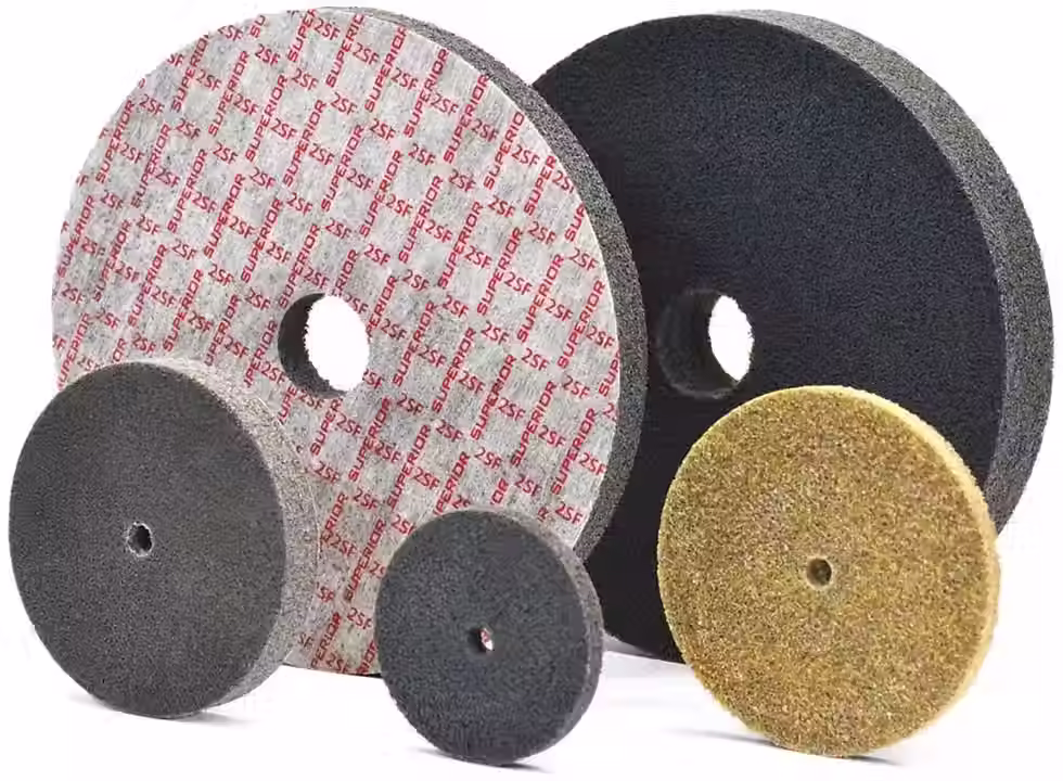 A selection of Superior Abrasives discs, including non-woven and resin fiber varieties, in multiple sizes and grits.