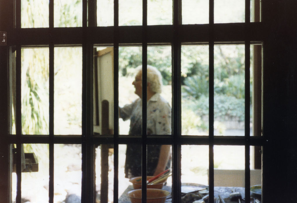 Roberto painting, deeply immersed in his art.