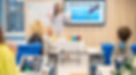 woman-standing-children-sitting-desks_edited.jpg