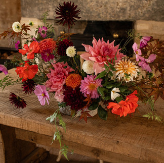 Registrars table with bright rustic flowers at Ivy Lodge