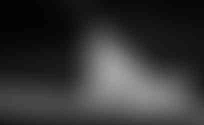 Bride running through grounds in black and white at Ivy Lodge