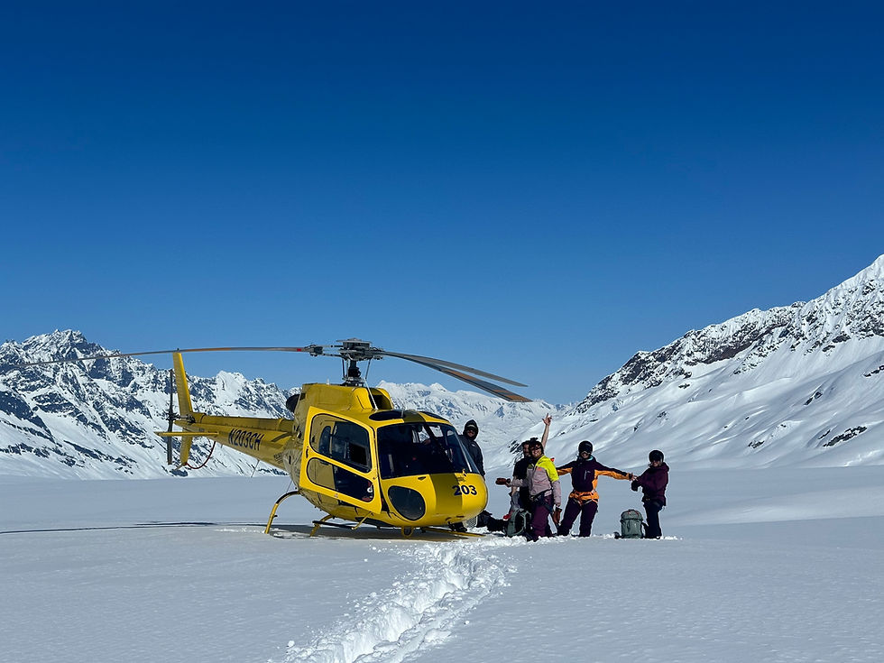 helicopter on snow with women in the background