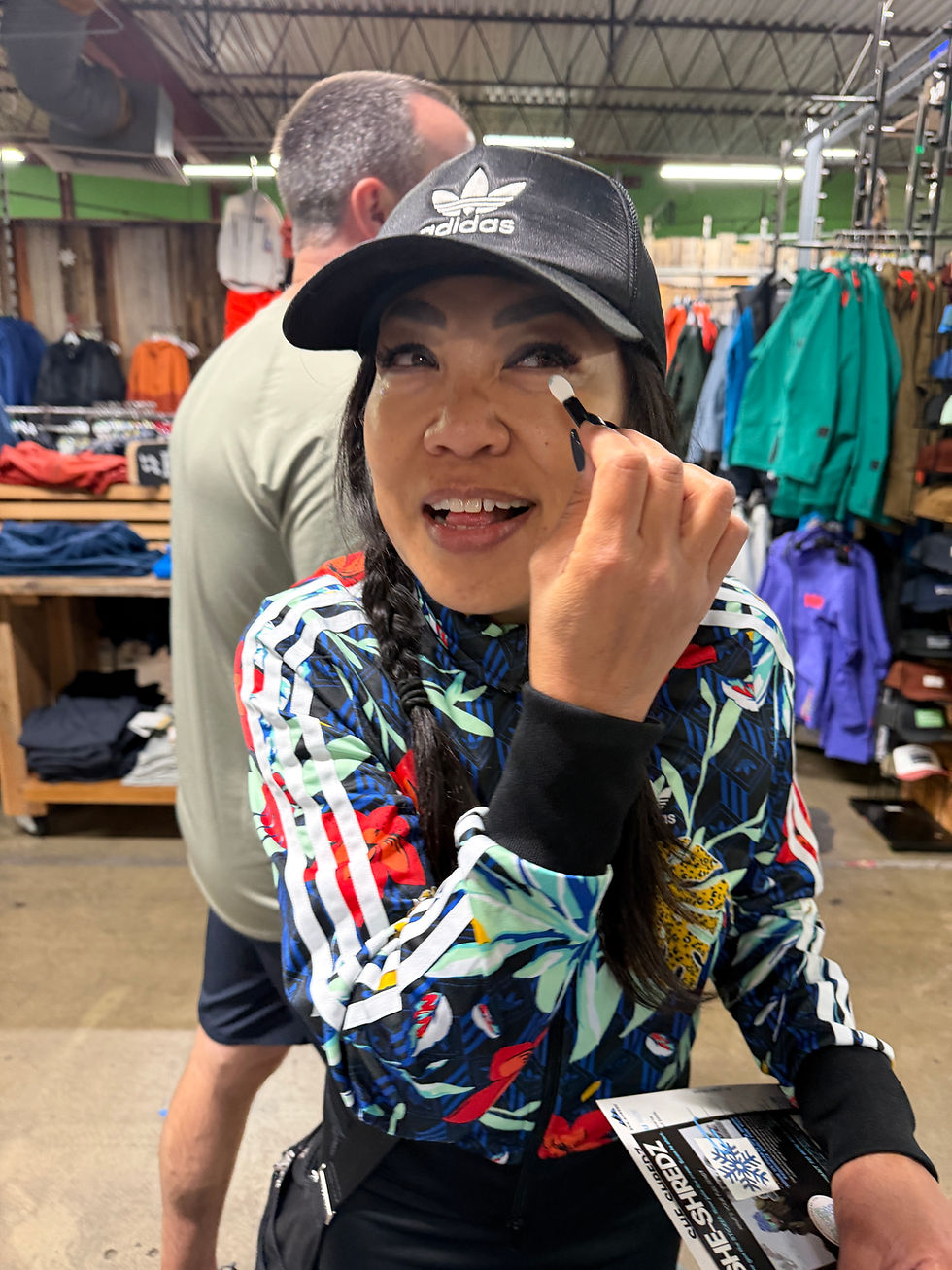 woman applying glitter at a store