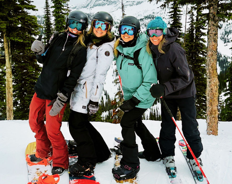women snowboarding