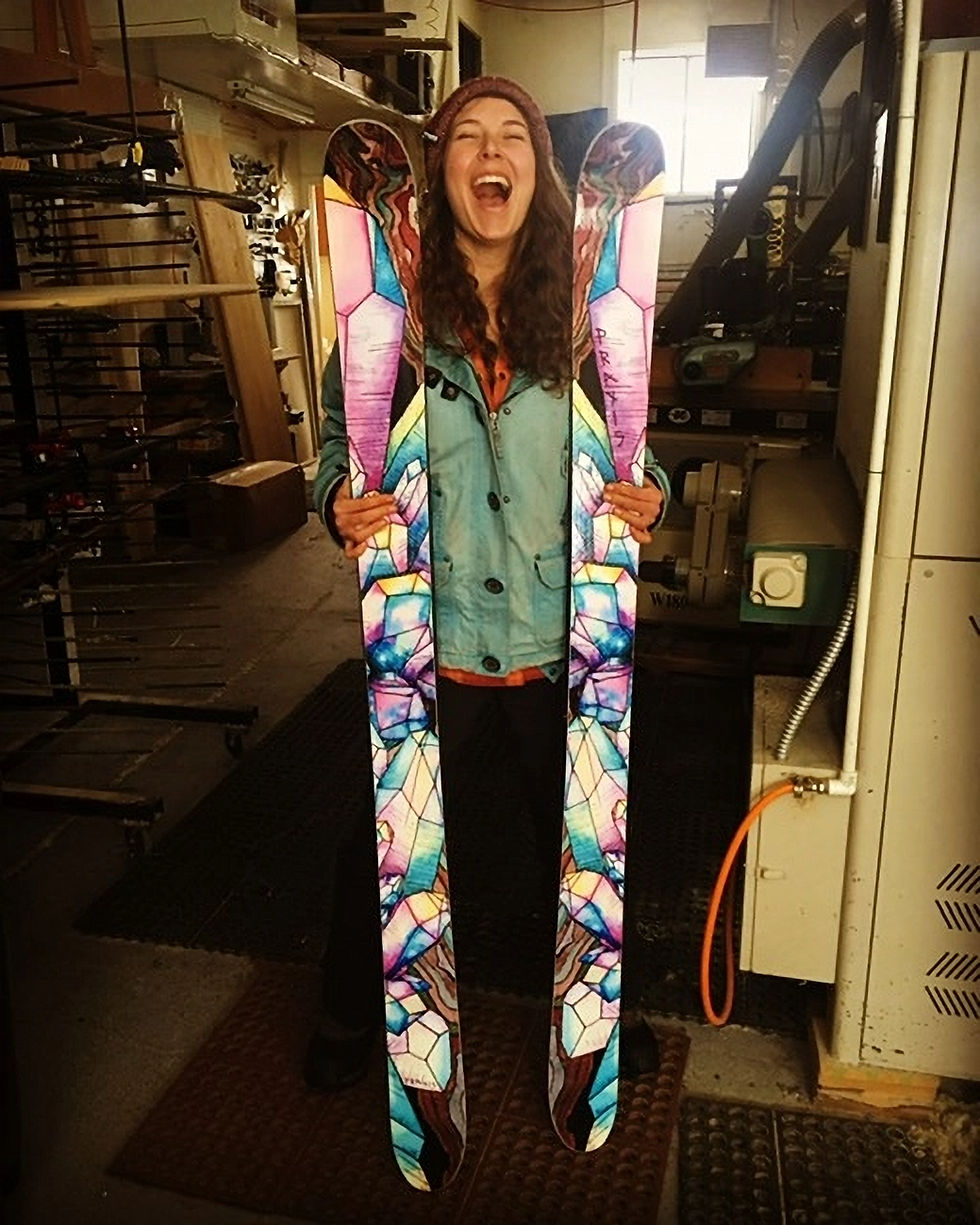 woman in ski shop with skis