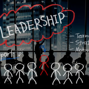 A conceptual business image illustrating leadership. In a modern office overlooking a city at night, a silhouetted leader presents to a team. The word "LEADERSHIP" is highlighted in a large, hand-drawn red cloud. Surrounding text includes "Teamwork," "Strategy," and "Motivation." Below, a row of stick figures represents the team, with the central leader figure colored red.