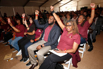 group of people raising their fist