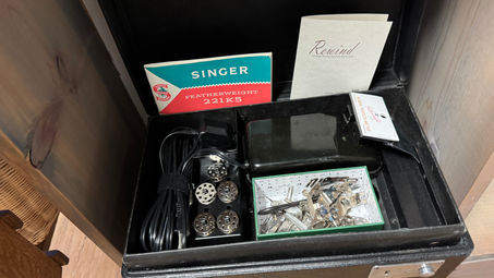 What's in the box
Each sewing machine includes a vintage tension tester, 5 new bobbins as well as any older bobbins that are in good condition, new bobbin felt and spring, new LED light bulb, new felt drip pan cover, replacement feet for the machine and foot controller, new wiring for the foot controller. and a 1/4” presser foot.

This machine also includes a vintage 221KS manual, a few vintage attachments, and an original screwdriver set for the machine and bobbin case.