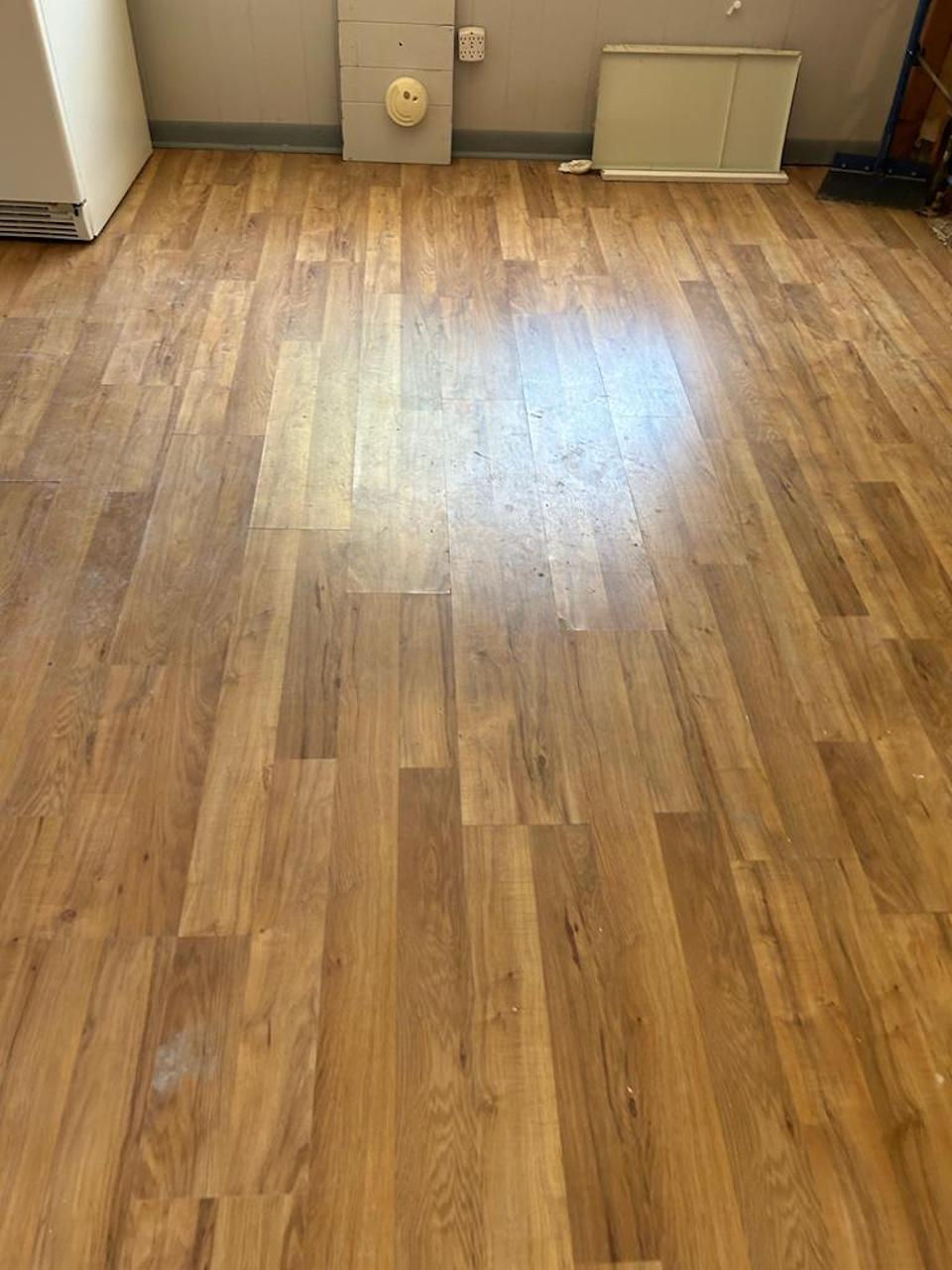 New wood-look laminate flooring for bathroom remodeling.