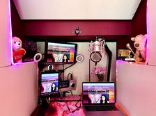 Interior of Yomary's booth. In view is a Neumann TLM 103, an Apogee Symphony, a monitor, a laptop an iPad, and Decor. 