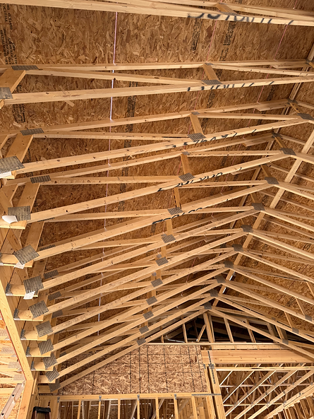 Wooden roof trusses installed in a new house structure