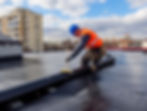 man-wearing-orange-vest-is-working-roof.jpg