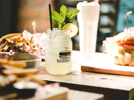 Cocktail in mason jar and burgers