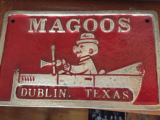 Photo of a Magoos Car Club metal plaque.