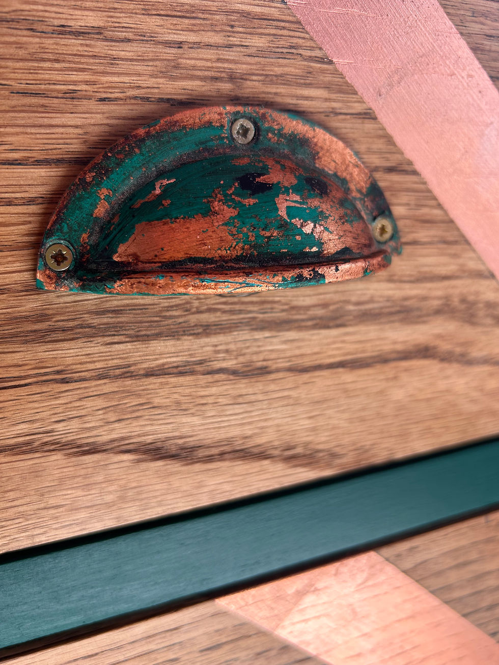 Thumbnail: Cup handles on chest of drawers.