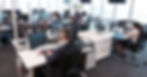 Office staff working at computers in a calm business environment with managed IT support in place.
