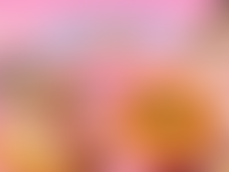 Samyang Buldak Carbonara ramen package next to a bowl of carbonara-style spicy ramen with sausage, mushrooms, and cheese.