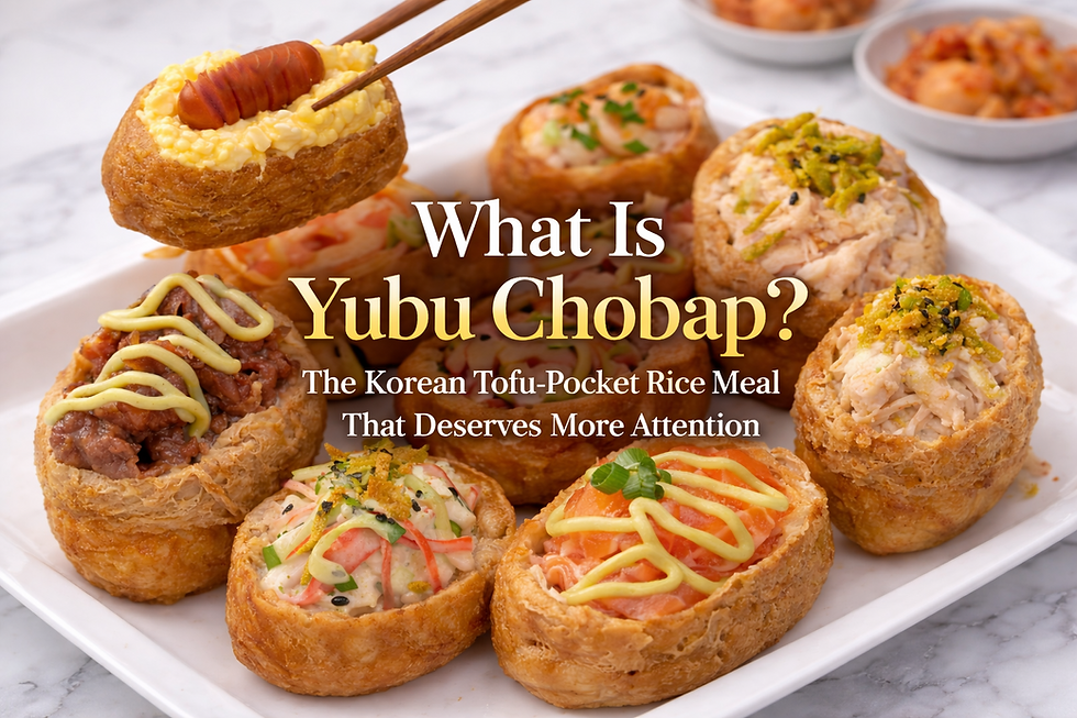 Premium blog thumbnail featuring assorted yubu chobap on a white plate over a white marble table, with colorful tofu-pocket rice pieces topped with beef, salmon, crab salad, and tuna beneath the title “What Is Yubu Chobap?”