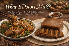 Premium blog thumbnail for Dotori Muk featuring Korean acorn jelly two ways: a glossy sliced jelly block on a plate and a seasoned acorn jelly salad with greens, carrots, and sesame seeds, with elegant title text about what dotori muk is.