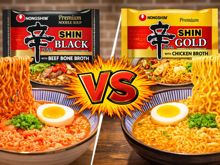 Side-by-side bowls of Shin Black and Shin Gold ramen with chopsticks lifting noodles from each bowl and a comic-style VS burst in the center.