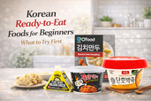 Korean ready-to-eat foods for beginners featuring kimchi pork dumplings, plant-based bulgogi kimbap, spicy instant ramen bowl, and pumpkin porridge in a clean kitchen setting