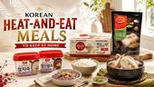 Wide landscape thumbnail titled “Korean Heat-and-Eat Meals to Keep at Home,” featuring a bright, premium kitchen scene with Korean ready-to-eat meal products, including instant porridge containers, packaged rice, and a ginseng chicken soup pack. Bowls of rice, red bean porridge, and samgyetang-style chicken soup are arranged on a sunlit countertop, creating a clean, commercial grocery-style image for convenient Korean meals at home.