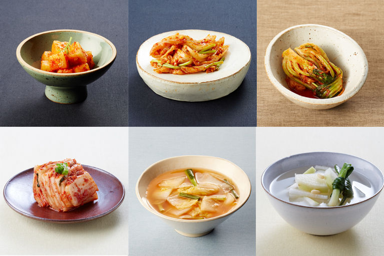 Six-panel collage showing different kimchi varieties served in small bowls and plates, including cubed radish kimchi, napa cabbage kimchi, water kimchi, and mild white kimchi.