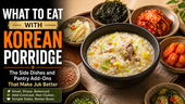 Korean porridge thumbnail showing a black bowl of chicken and vegetable juk surrounded by side dishes like kimchi, roasted seaweed, pickled radish, cucumber, and salted shrimp, with bold text about what to eat with Korean porridge.