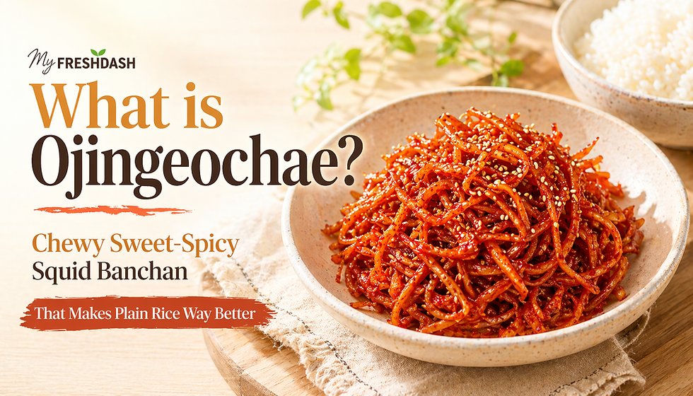 Bright blog thumbnail for MyFreshDash featuring a bowl of glossy ojingeochae, a Korean sweet-spicy shredded dried squid banchan, topped with sesame seeds and served beside a bowl of white rice. Large headline text reads “What is Ojingeochae?” with subtext “Chewy Sweet-Spicy Squid Banchan” and “That Makes Plain Rice Way Better.