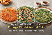 Blog thumbnail showing three Korean jeon varieties displayed separately—kimchi jeon on the left, seafood jeon in the center, and chive jeon on the right—with the headline “Beginner’s Guide to Korean Jeon Fillings: Kimchi, Seafood, Chive, and What Makes Each One Worth Making.”