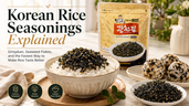 Bright Korean rice seasonings thumbnail showing gimjaban seaweed flakes on a bowl of white rice, seaweed rice balls, a plate of seasoning flakes, and title text about easy ways to make rice taste better.