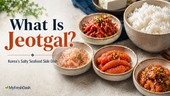 Premium Korean jeotgal thumbnail featuring small bowls of salted shrimp, spicy squid, myeongran pollock roe jeotgal, and other seafood banchan beside a bowl of white rice, with headline text reading “What Is Jeotgal?”