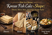 Landscape infographic titled “How to Choose Korean Fish Cake by Shape” showing four types of Korean fish cake in side-by-side panels: stacked sheets, folded triangular slices on a wooden board, skewered bars in broth, and soup-ready fish cake pieces in a bowl, styled with warm brown tones and elegant gold lettering.