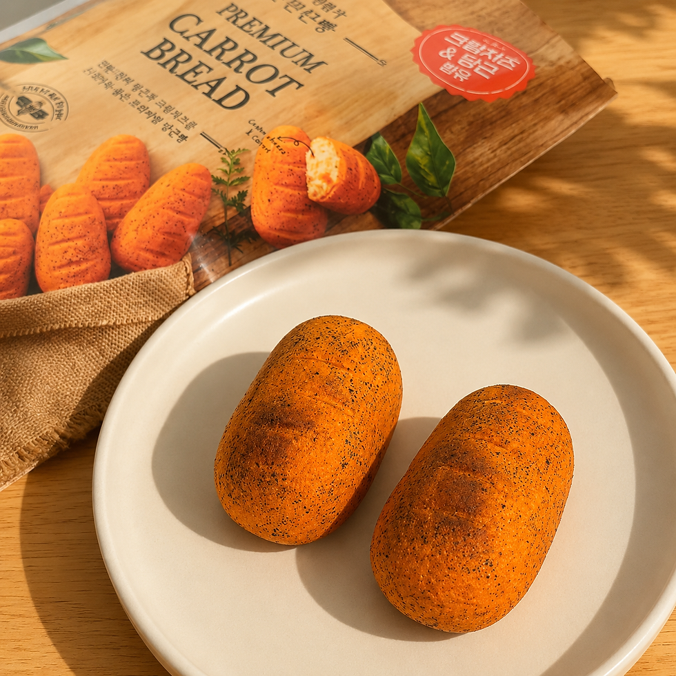 Two orange carrot breads sit on a white plate beside the Premium Carrot Bread package on a sunlit wooden table.