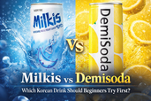 Commercial thumbnail comparing Korean drinks Milkis and Demisoda Lemon, with Milkis on a blue fizzy background and Demisoda on a bright yellow citrus background, plus the text “Milkis vs Demisoda: Which Korean Drink Should Beginners Try First?”