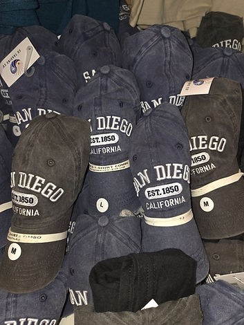 folded hat and tee combos in gray and navy color