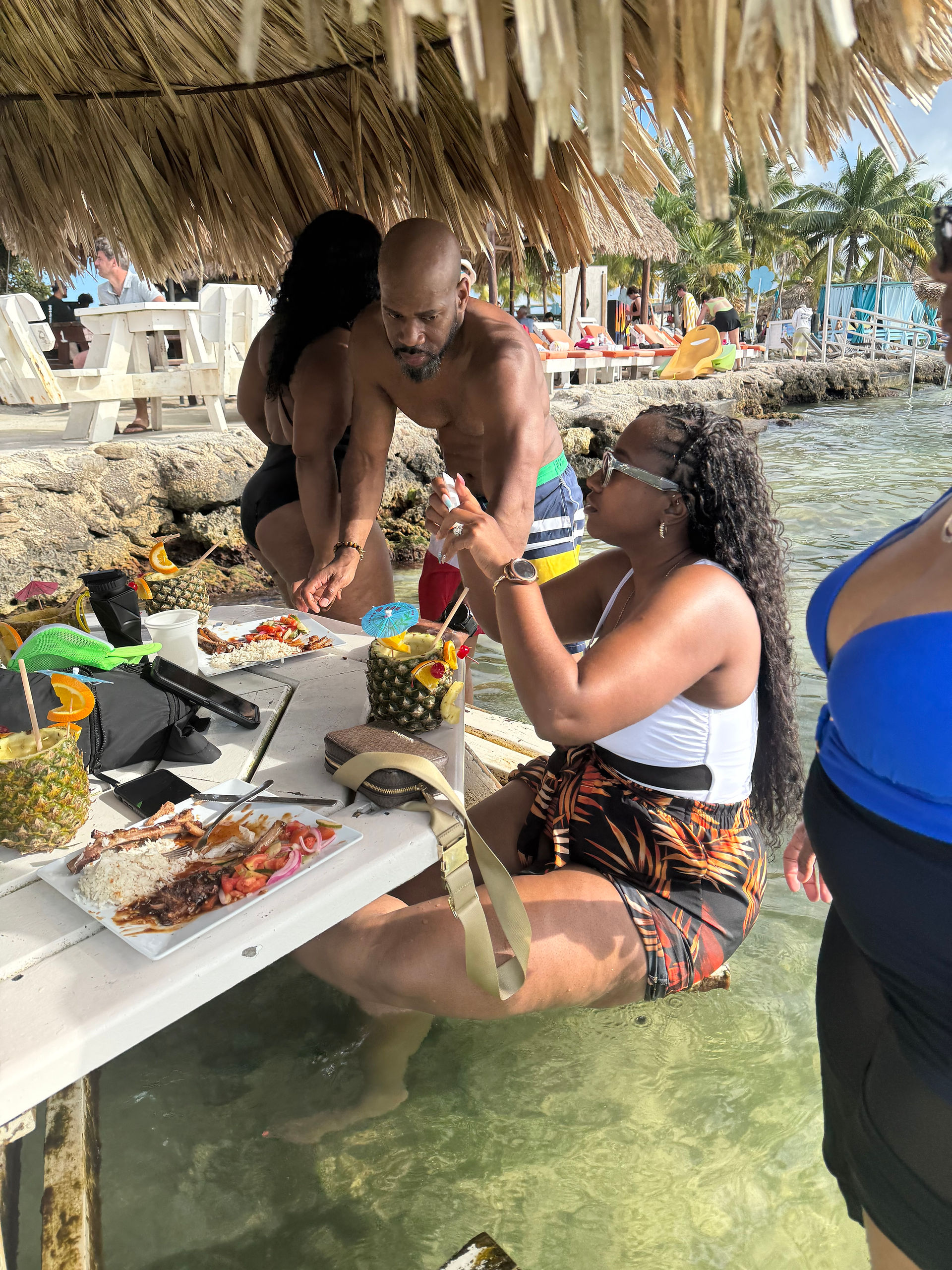 picnic table in ocean at Secret Beach Belize dining experience
