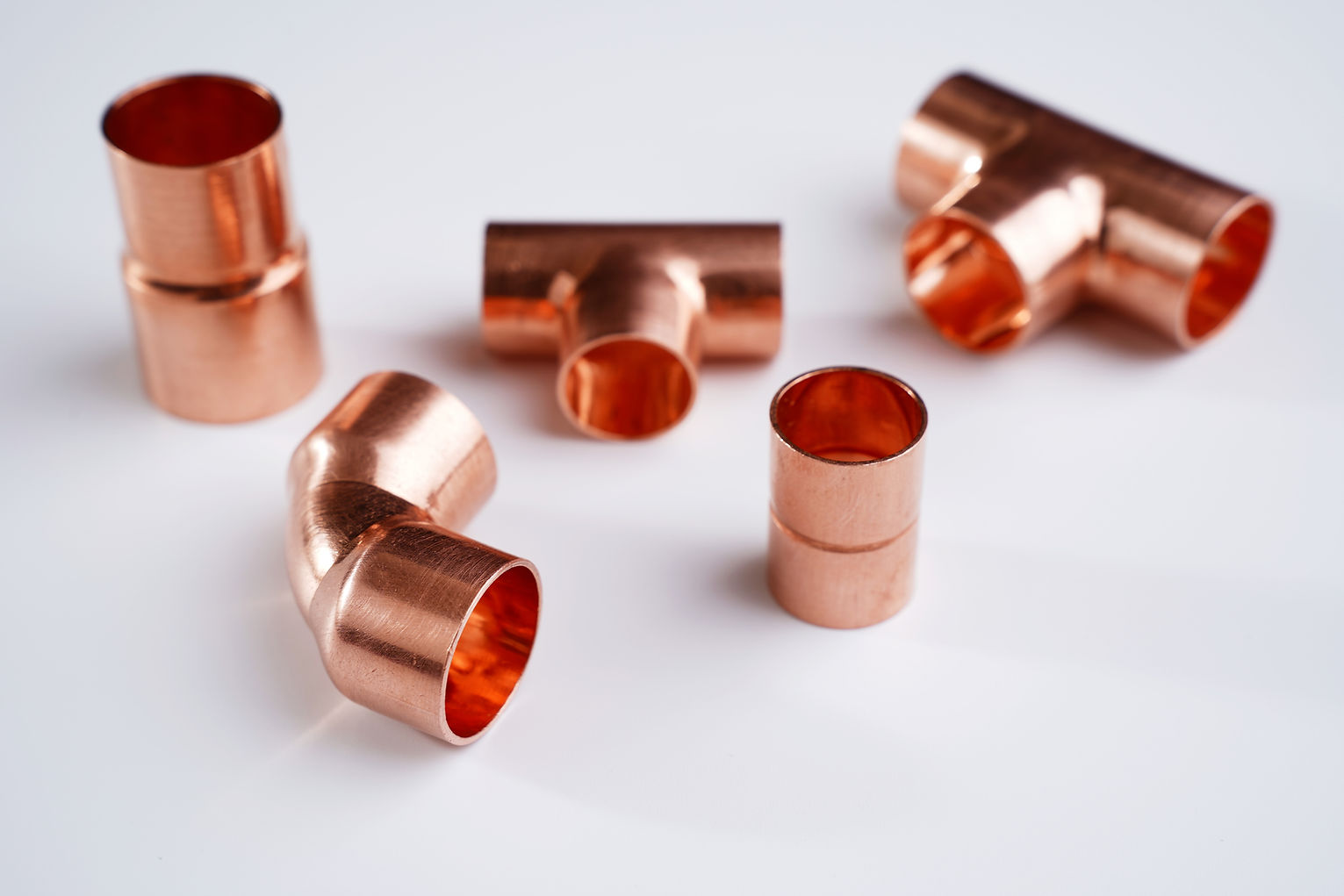 Copper plumbing fitting adapter copper pipe accessories isolated at white