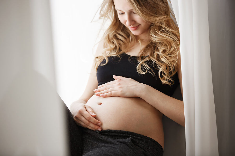 close-up-detail-young-blonde-pregnant-mother-black-outfit-sitting-window-sill-bedroom-touc