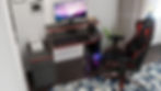 "3D visualization of a minimalist computer desk with built-in storage and monitor stand"