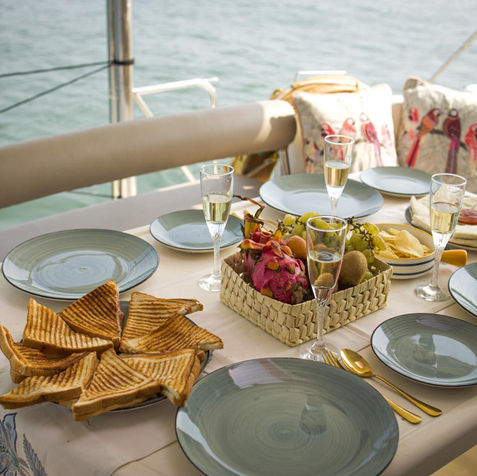 Luxury brunch spread on the outdoor seating to enjoy the waves as you sail