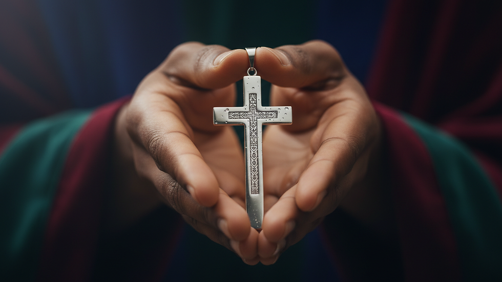 Close-up view of hands holding a cross pendant
