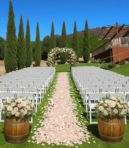Formal outdoor wedding ceremony at Sunmist Estate featuring an aisle heavily layered with pink and white rose petals