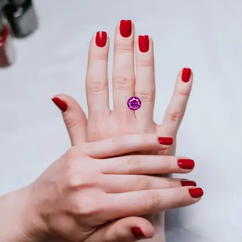 Person is showing purple garnet on hands