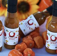 Artisan Haitian hot sauces handcrafted with fresh peppers and bold Caribbean flavors.