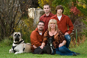 Boise portrait photograph of a family with their two sons and a large dog in Kathryn Albertson Park, Boise, Idaho.