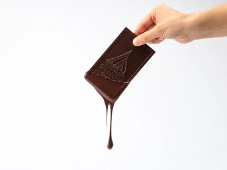 Melted chocolate bar being compared to fiat money