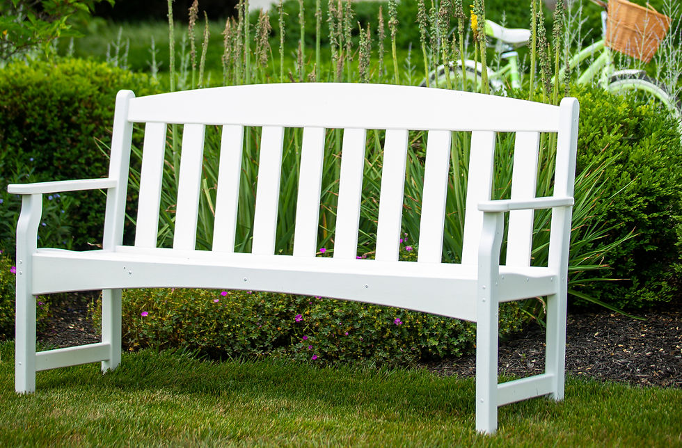 A white polywood garden bench.