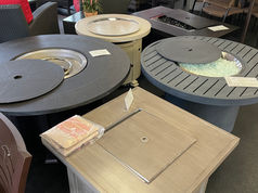 A series of fire pits in varying colors