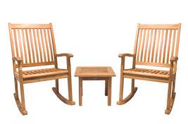 Two teak rocking chairs with an end table.